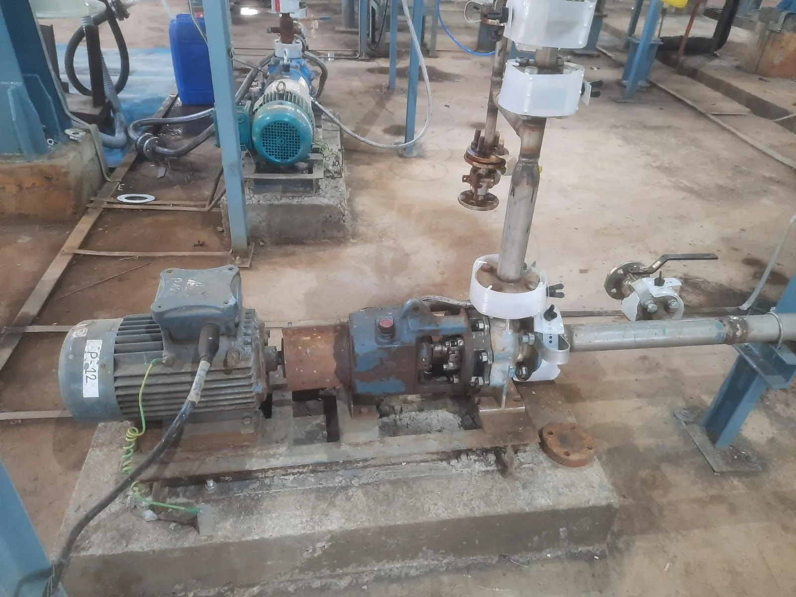 Horizontal process pump and motor installed on a concrete foundation in a process plant